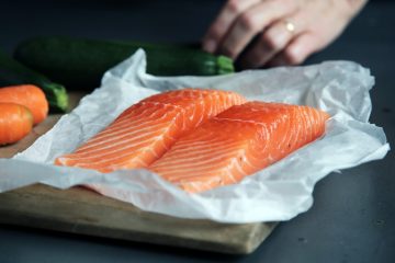 raw fish meat on brown chopping board