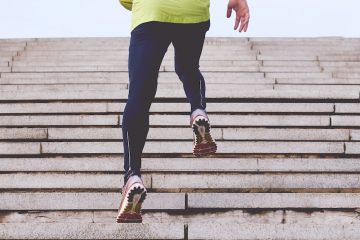 person climbing concrete stairs